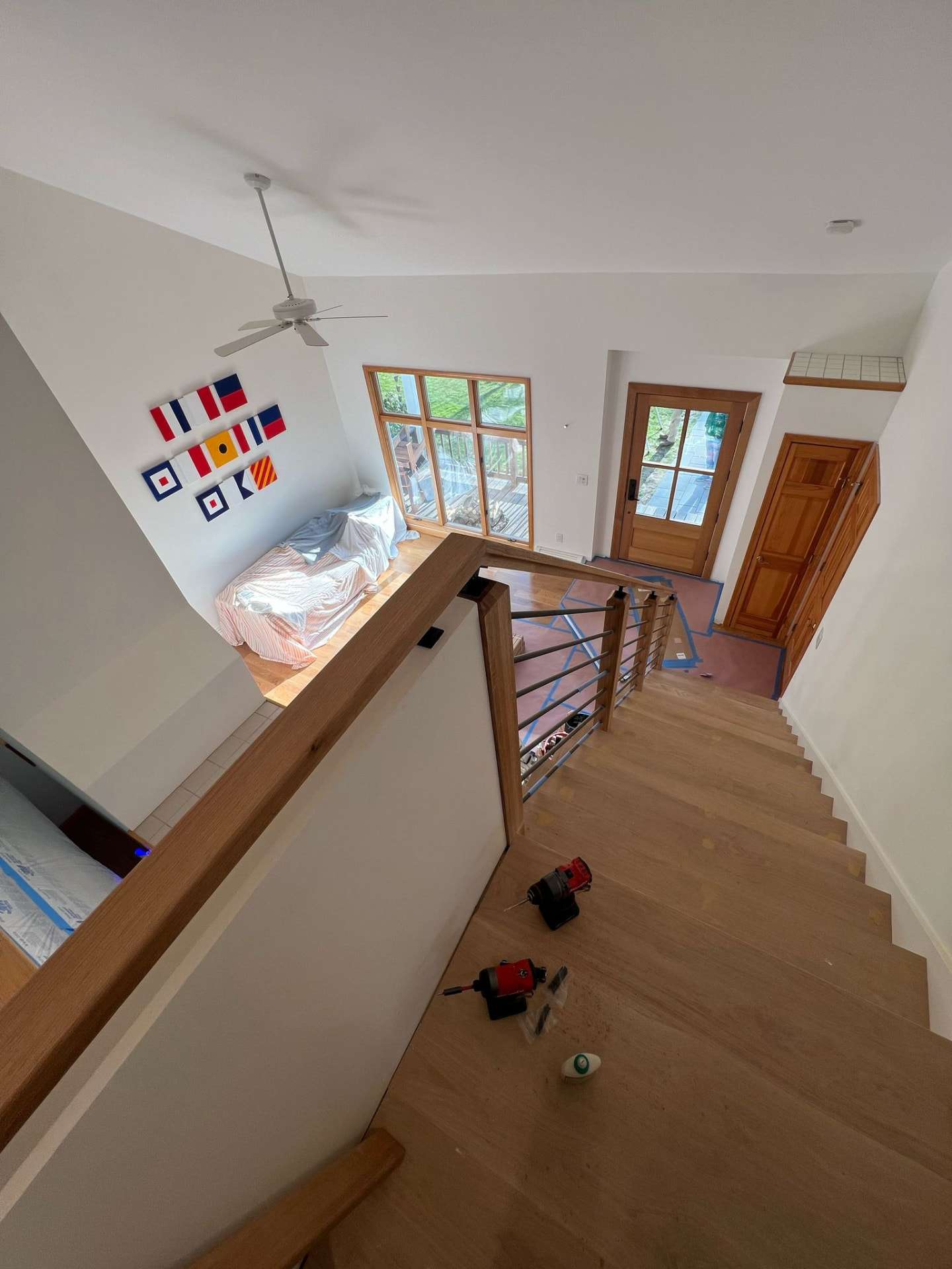 Custom oak staircase with black metal balusters